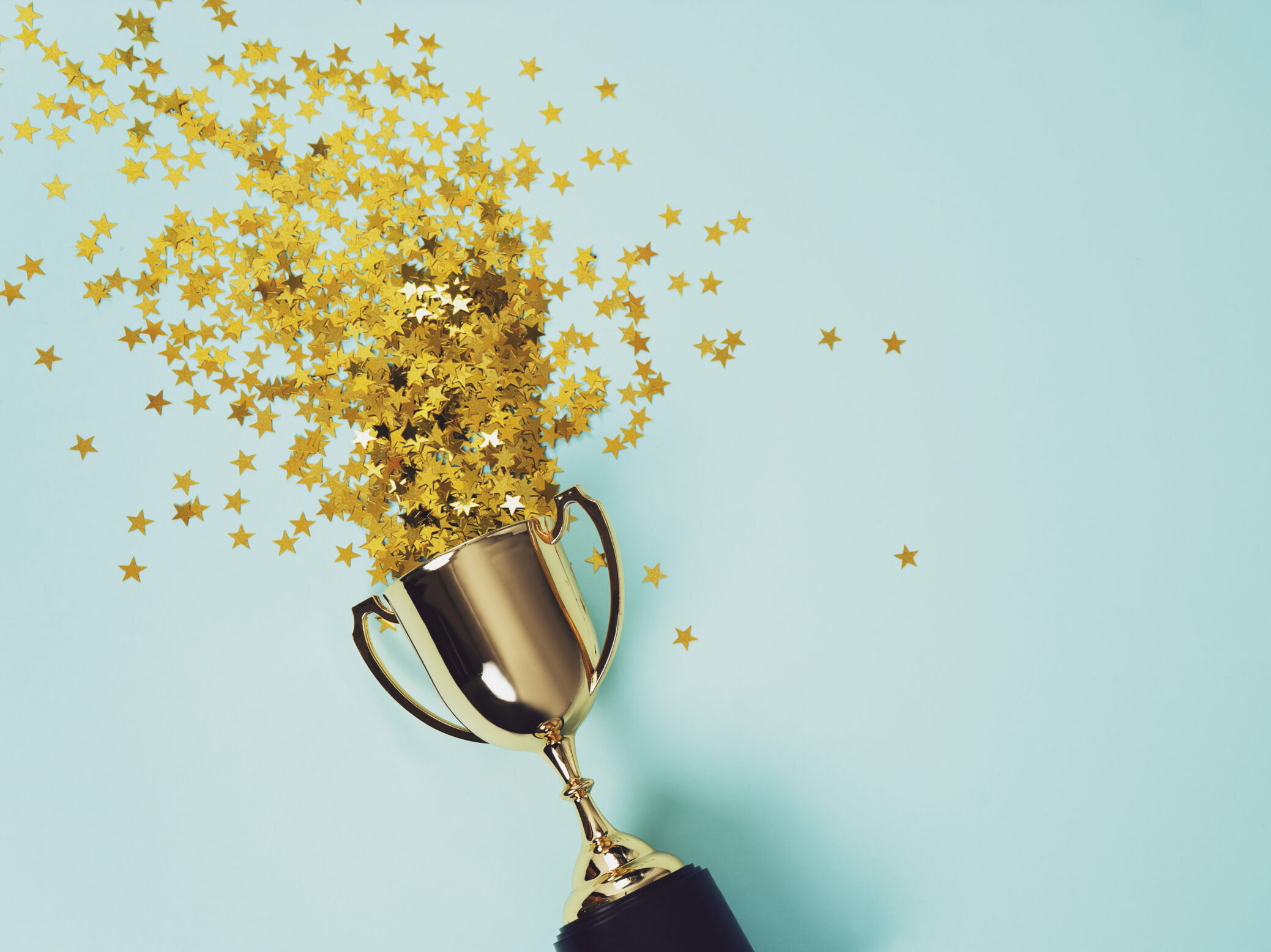 gold winner cup on blue background