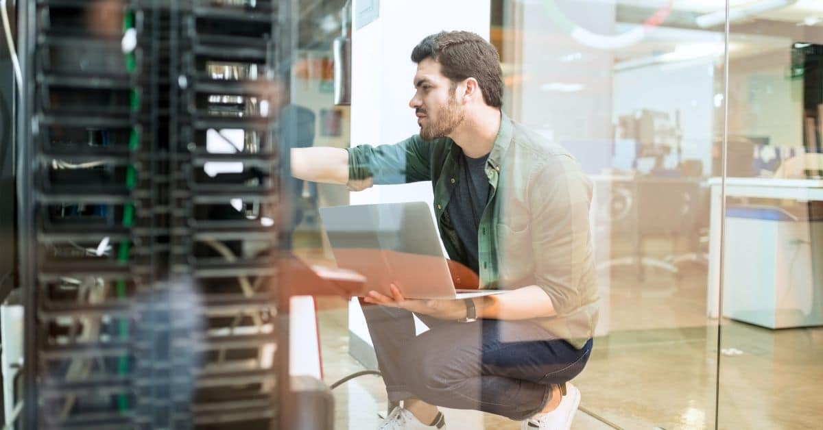 Network technician performs preventive maintenance on small business servers